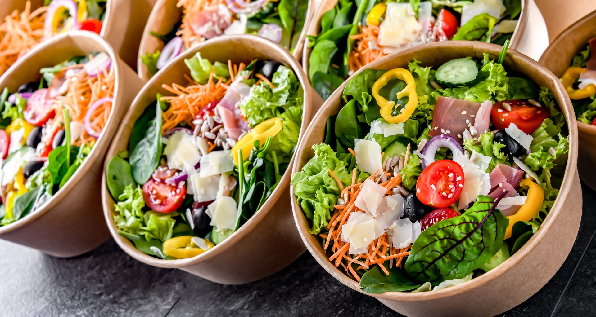 Paper boxes with pre-packaged vegetable salads ready for sale